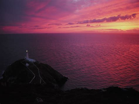 2048x1536 Resolution Lightened Lighthouse On Black Island Near Body