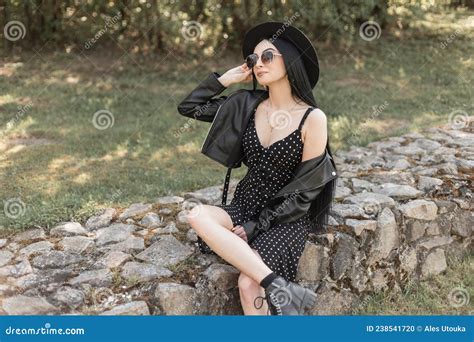 Comely Young Woman In Sunglasses In Beautiful Hat In Fashionable Casual