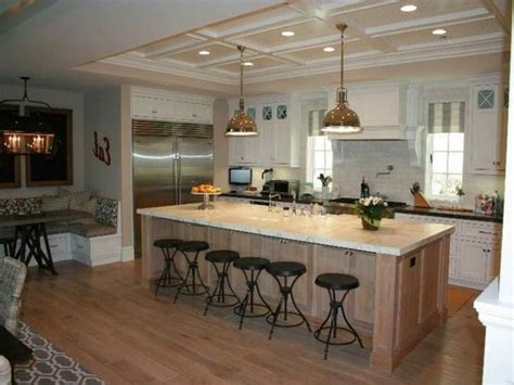 A wall was removed to make way for the large island. 18 Compact Kitchen Island with Seating for Six ideas