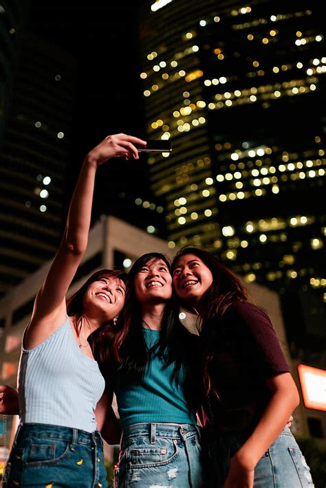 Asian Friends Women Taking A Selfie In The Coffee Shop By Stocksy Contributor Santi Nuñez