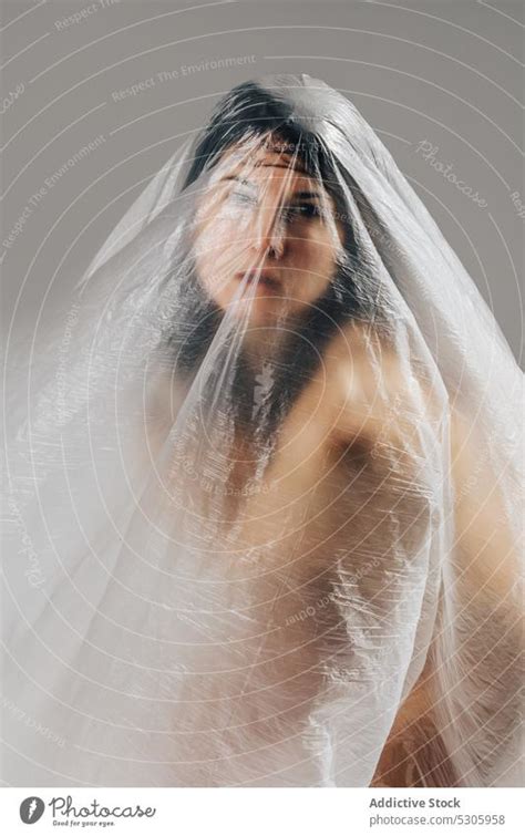 Naked Woman Wrapped In Cellophane A Royalty Free Stock Photo From