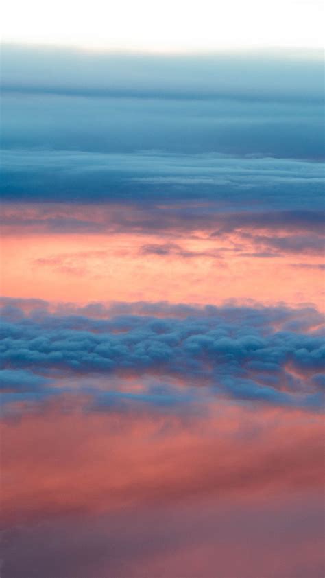 Download Wallpaper 1080x1920 Clouds Sky Porous Sunlight Sunset