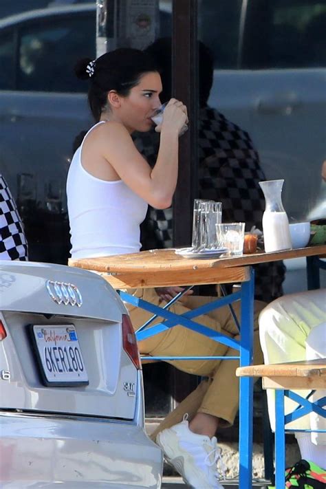 Kendall Jenner Wears A White Tank Top And Cargo Pants While Out To