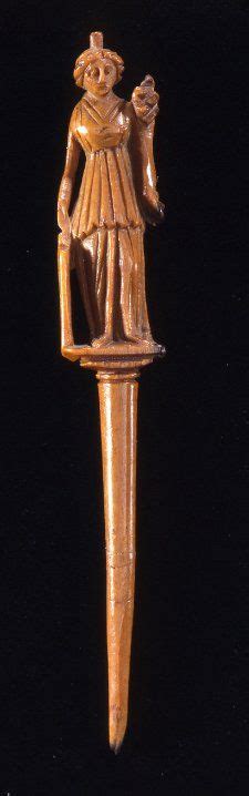 A Second Century Romano British Bone Hairpin Decorated With The Figure