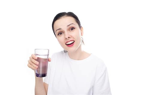Premium Photo Smiling Woman In A White Tshirt Holds A Glass Of Water