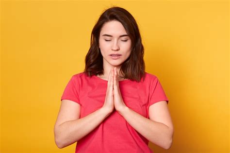 Premium Photo Studio Shot Of Caucasian Female Prays For Wellness Of