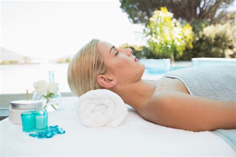 Beautiful Woman Lying On Massage Table At Spa Center Stock Image