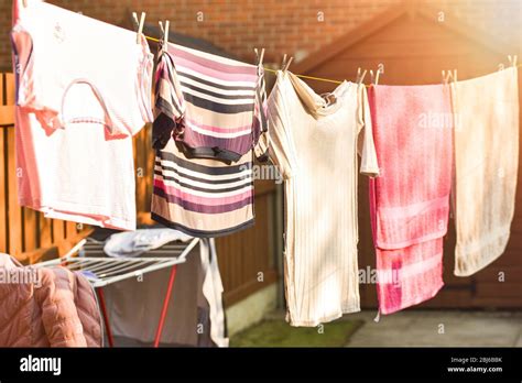 Clothes Hanging On Washing Line Laundry Hanging Out To Dry Outdoors In