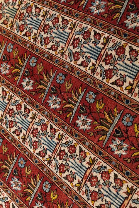 These rugs were historically woven in persia and surrounding areas with a signature blend of geometric and floral designs. Persian Qum Rug