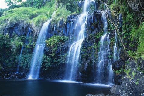 Hawaii Maui Hana Coast Waterfall Flows Into Blue Pool Pacificstock
