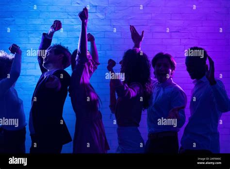 Cheerful Young People Dancing Having Fun At Night Party Indoor Stock