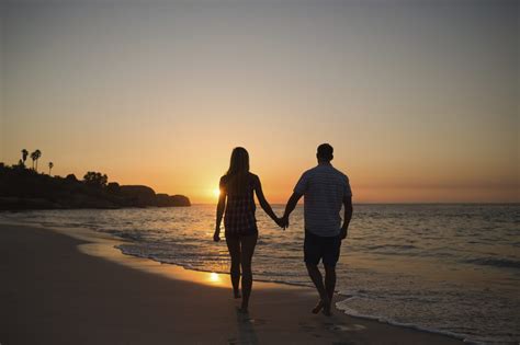 Couple Holding Hands While Walking On Beach Couples Couples Beach Photography Beach Scenes