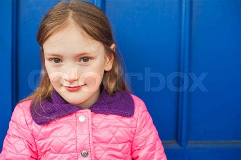 Close Up Portrait Of A Cute Little Girl Of 7 Years Old Wering Bright