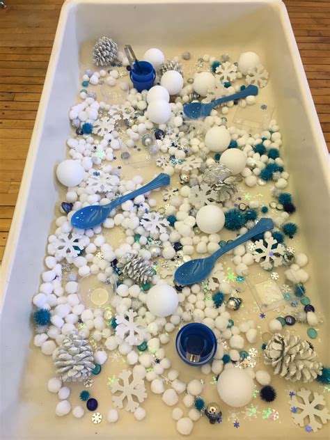 Preschool Winter Sensory Table Pom Poms Snowflake Sequins Glass