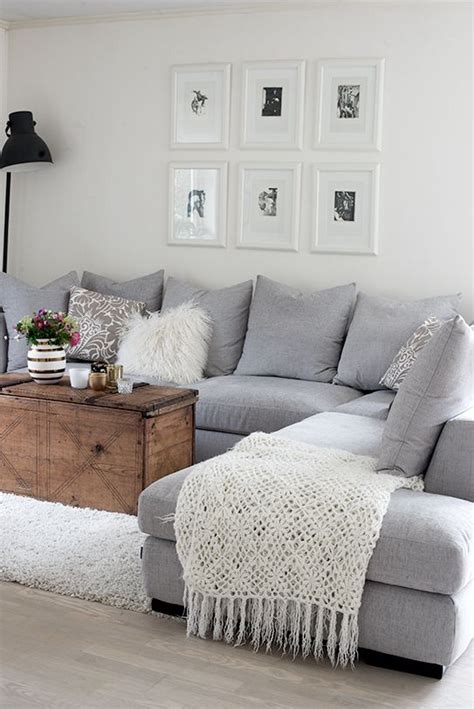 A white fireplace and ceiling beams balance dark walnut floors. More Grey/White living rooms: 10 splendid living rooms