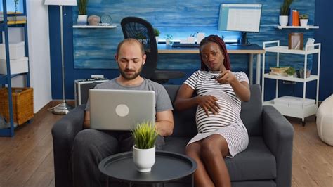 Premium Photo Pov Of Pregnant Interracial People Looking At Camera Watching Television In