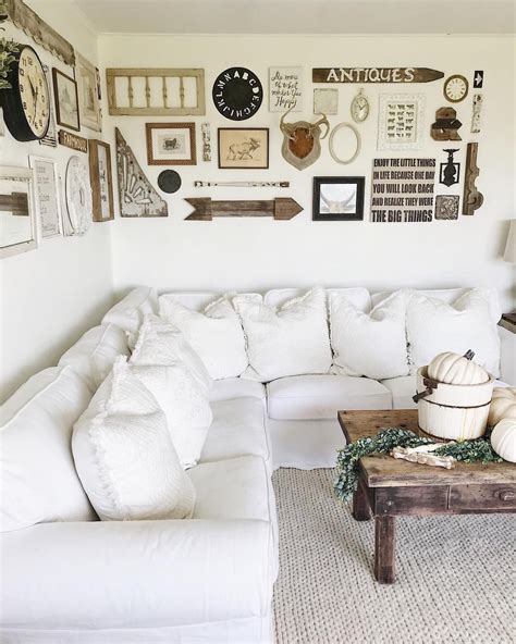Rustic living room with large eclectic gallery wall | Eclectic gallery wall, Rustic living room ...