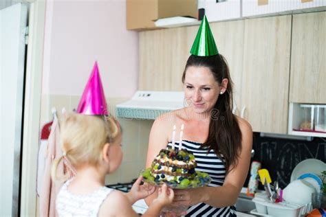 Mother Giving Her Cute Daughter Birthday Cake With Candles Stock Image Image Of Celebration