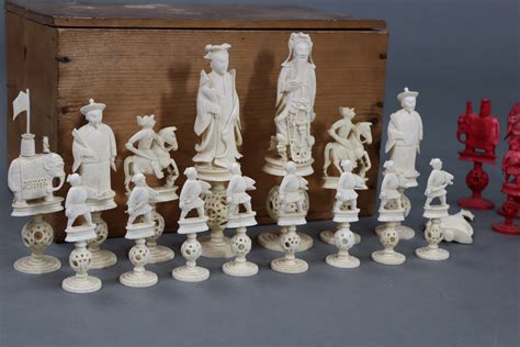 A 19th Century Chinese Carved Ivory Chess Set Of Natural And Red Stained