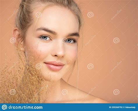Portrait Of Young Beautiful Woman With A Healthy Skin Of Face