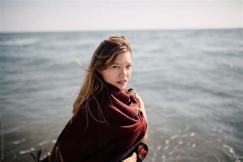 A Portrait Of A Beautiful Woman Covered With A Blanket On The Beach