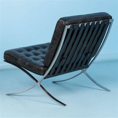 Its initial design was developed from the. Black Leather Barcelona Style Chair with Chrome Legs at ...