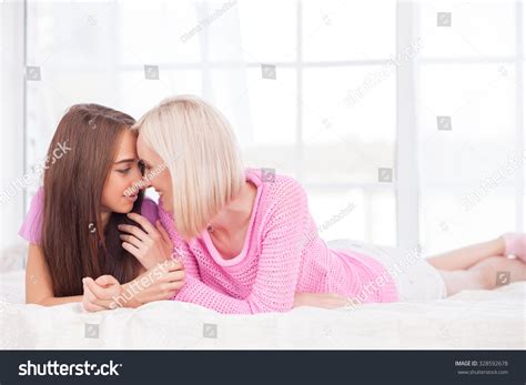 Beautiful Young Lesbian Couple Relaxing Smiling Stock
