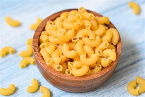 Macaroni Top View On Wooden Bowl Background Close Up Raw Macaroni