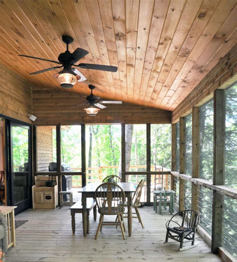 A Porch With Wooden Floors And Ceiling Fans