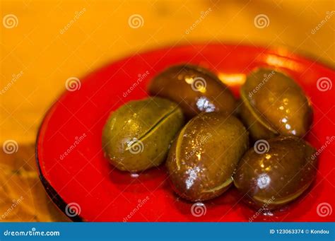 Large Marinated Olives On A Red Saucer Stock Photo Image Of
