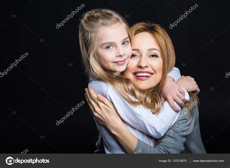 Mother And Daughter Embracing Stock Photo By ©igortishenko 137215670