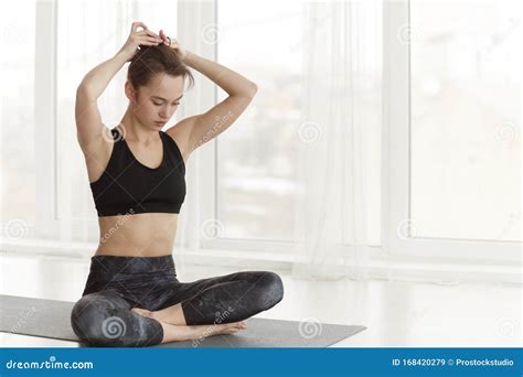 Yogi Woman Tying Hair Before Workout At Yoga Studio Stock Image Image