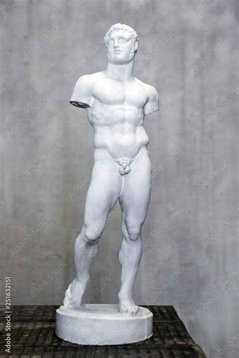 Statue Of Naked Babe Man Armless Roman And Greek Art Small Plaster Copy Of Sculpture Stock
