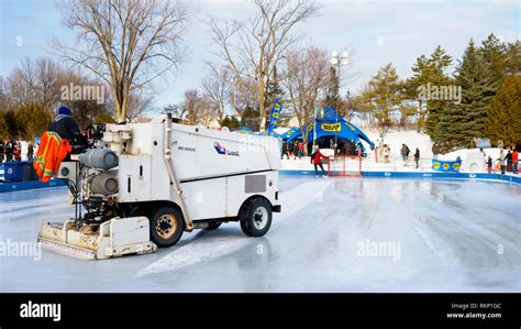 Zamboni Resurfacing Machine Cleaning The Ice On An Outdoor Skating Rink