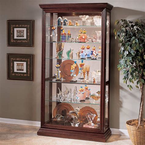 Features adjustable glass shelves, interior lighting, drawer storage and open lower shelf. Darby Home Co Nancy Eden Lighted Curio Cabinet & Reviews ...