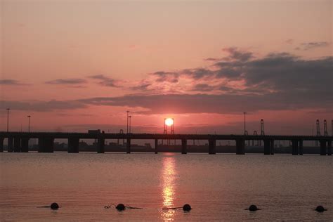 Wallpaper Sun Sea Bridge Orange Sunset Glow Water Clouds Sky