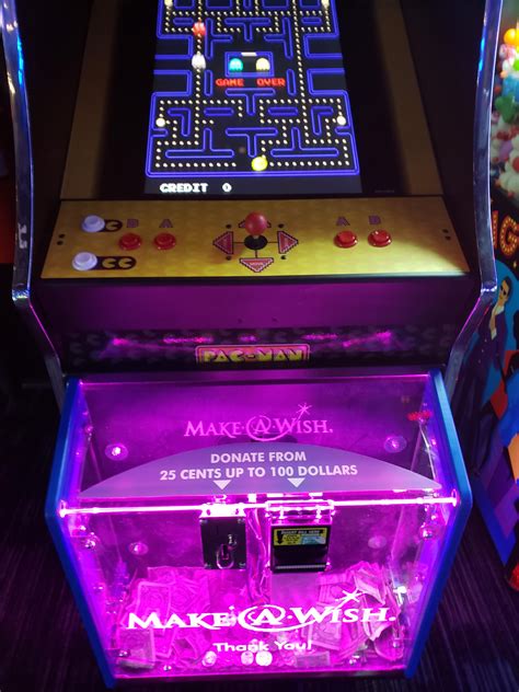 This Arcade Machine With A Make A Wish Donation Box On The Front R