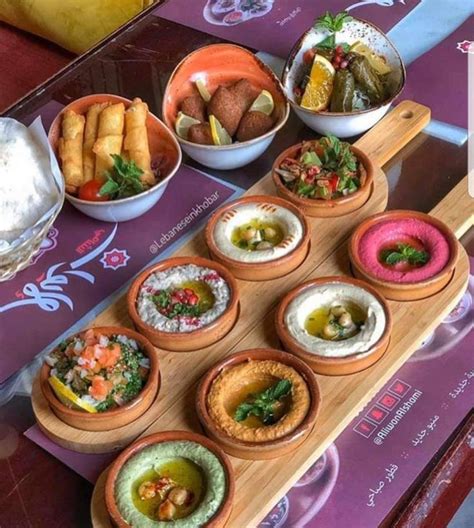 A Table Topped With Bowls Filled With Different Types Of Food And