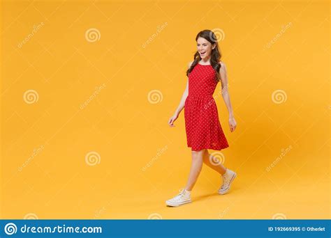 Side View Of Beautiful Young Brunette Woman Girl In Red Summer Dress
