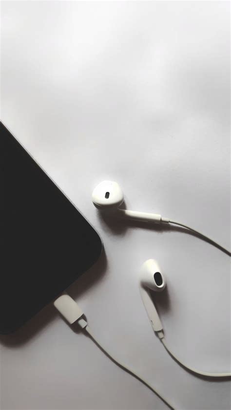 White Earphones With Mobile Headphones Wallpapers In Black Background