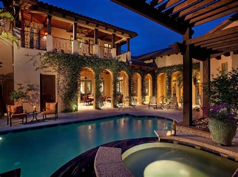 This beautiful rolling hills ranch home boasts a stunning courtyard with tranquil fountain and a grape vine trellis. 40 Spanish Homes For Your Inspiration