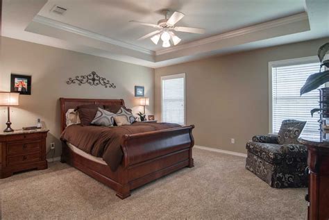 They are often also found in master bedrooms and hallways. The tray ceiling and crown molding add a simple, yet ...