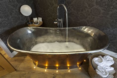 Luxurious Bubble Bath In Our Hand Crafted Copper Roll Top Bath With Floor Lighting To Offer More