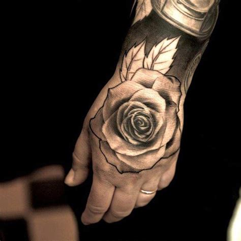 Lovely Rose Flower On Hand Tattoo For Men Hand Tattoos For Guys Rose