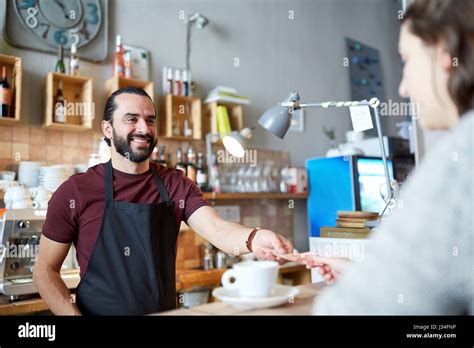 Man Or Waiter Serving Customer At Coffee Shop Stock Photo Alamy