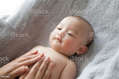 A Hand Touching A Baby Stock Photo - Download Image Now - iStock
