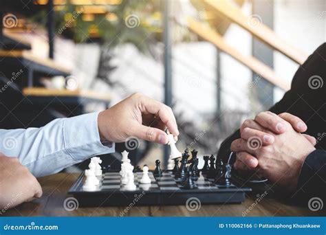 Confident Businessman Colleagues Playing Chess Game Overcome The Stock
