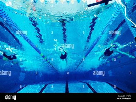 Underwater View Of High School Swim Team Members Working Out In A