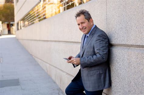 Middle Aged Handsome Businessman Using Mobile Phone App Sending Message