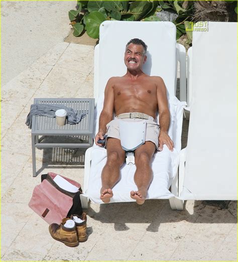 George Clooney Is A Shirtless Man Who Stares At Goats Photo